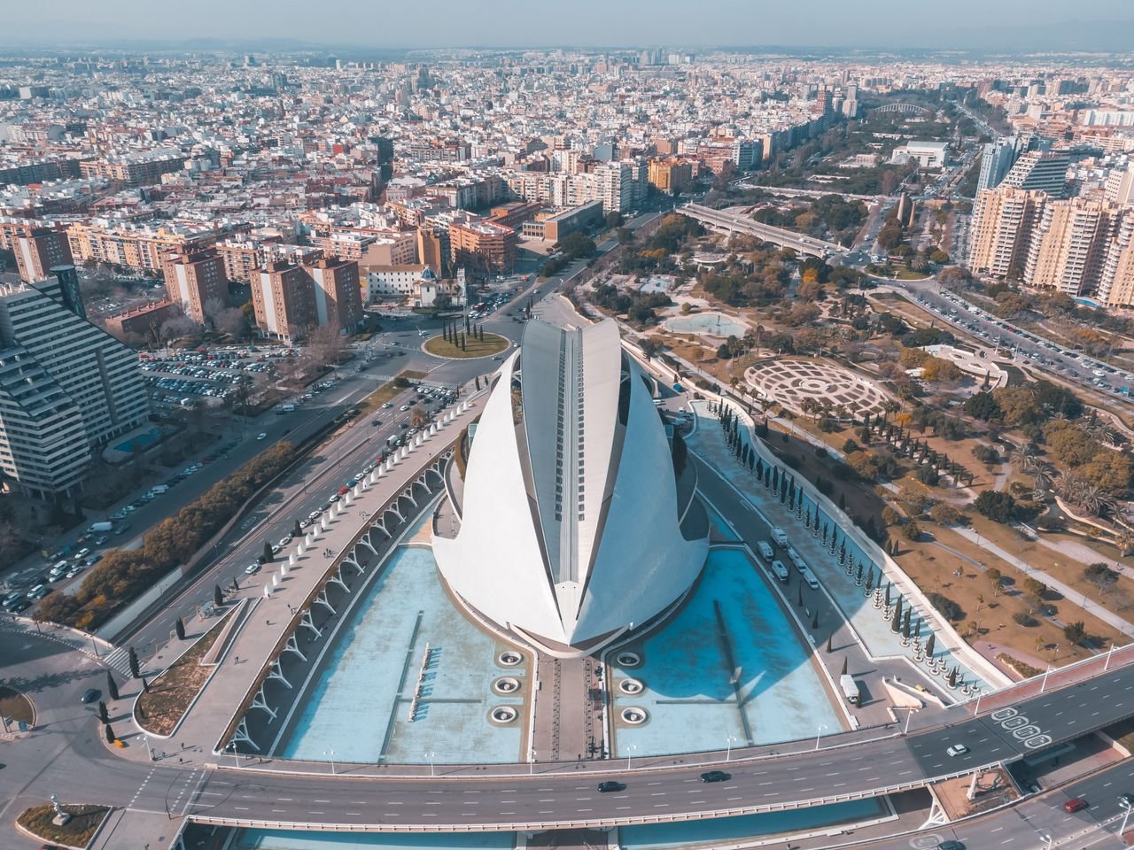 Home Stunning aerial shot of modern architectural landmark surrounded by urban cityscape.